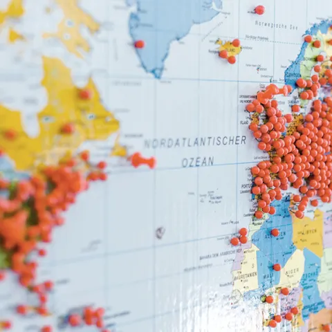Huge number of red pins in Europe  and other continents on a world map