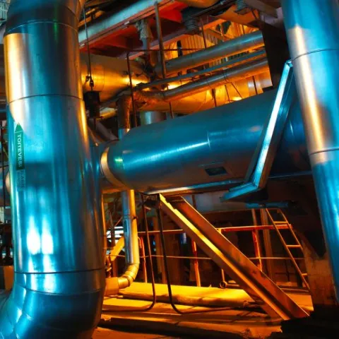 Equipment, cables and piping as found inside of a modern industrie